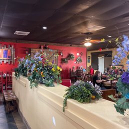 a row of flowers in a restaurant