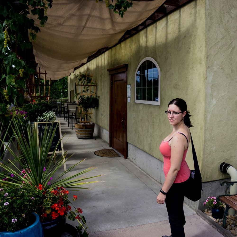 Black Widow Winery - a woman in a pink tank top and black pants - Wineries Near Me - Penticton, British Columbia