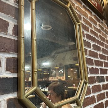 Foster's Grille - Dirty mirror above our table - Burgers Near Me - Cape Coral, Florida Foster's Grille - Dirty mirror above our table - Burgers Near Me - Cape Coral, Florida