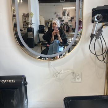 Bellisimo Salon - Bellisimo salon customer checking out this amazing place while getting a cut and color - Hair Stylists Near Me - San Marcos, California Bellisimo Salon - Bellisimo salon customer checking out this amazing place while getting a cut and color - Hair Stylists Near Me - San Marcos, California