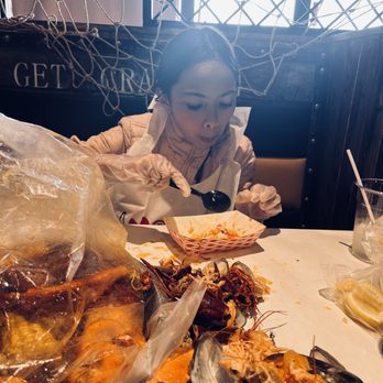 Bag O Crab - Enjoying her King Crab Leg (1LB) - Cajun/Creole Near Me - Vallejo, California