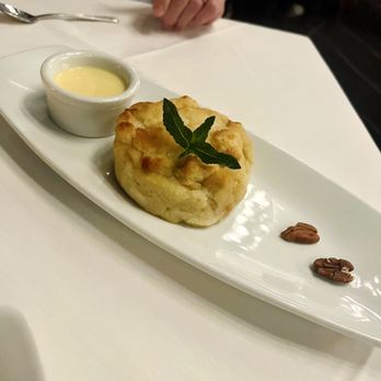 Ruth's Chris Steak House - White chocolate bread pudding with Frangelica-infused crème anglaise - Steakhouses Near Me - West Des Moines, Iowa Ruth's Chris Steak House - White chocolate bread pudding with Frangelica-infused crème anglaise - Steakhouses Near Me - West Des Moines, Iowa
