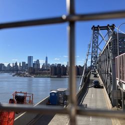 Williamsburg Bridge - Peering through the metal chain link barrier to lower Manhattan