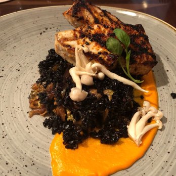 Tiffins Restaurant - swordfish with mushrooms, black rice, and creamy carrot-coconut purée - New American Near Me - Lake Buena Vista, Florida Tiffins Restaurant - swordfish with mushrooms, black rice, and creamy carrot-coconut purée - New American Near Me - Lake Buena Vista, Florida