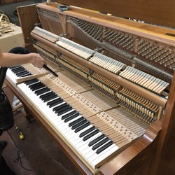 Dugger Music Services - Kelly at work on this old piano of mine.