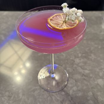 The Elliott Bar - Violet Vanguard- ube, mezcal & Chandon- $1 from each sold in March will benefit a local nonprofit that benefits women in our community - Bars Near Me - Seattle, Washington