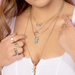 Torres Omar Jewelers - Pendant and rings in 14K gold.