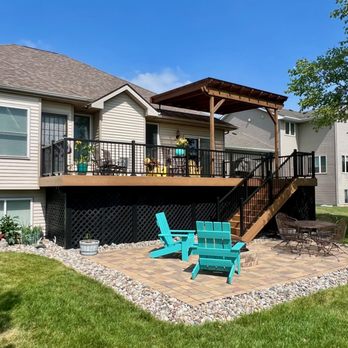 Custom Decks - Deck resurface with composite decking, aluminum railing, a rough cedar pergola, and custom storage underneath. - Decks & Railing Near Me - Johnston, Iowa Custom Decks - Deck resurface with composite decking, aluminum railing, a rough cedar pergola, and custom storage underneath. - Decks & Railing Near Me - Johnston, Iowa