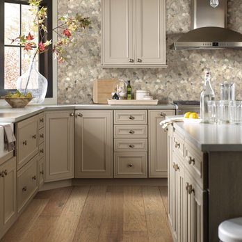 Molyneaux Home - a kitchen with white cabinets and wood floors - Flooring Near Me - Greensburgh, Pennsylvania Molyneaux Home - a kitchen with white cabinets and wood floors - Flooring Near Me - Greensburgh, Pennsylvania