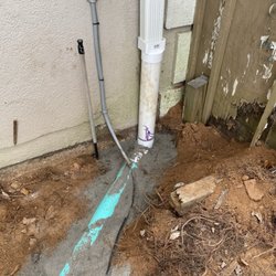 Reds Custom Pavers - Downspout from side gutter