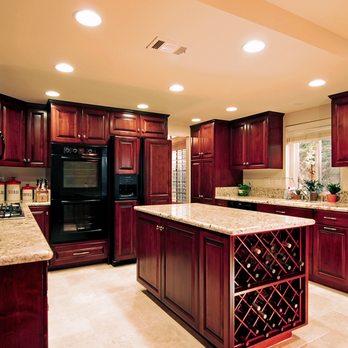Absolute Home Remodeling - a kitchen with cherry cabinets - General Contractors Near Me - Pompano Beach, Florida Absolute Home Remodeling - a kitchen with cherry cabinets - General Contractors Near Me - Pompano Beach, Florida