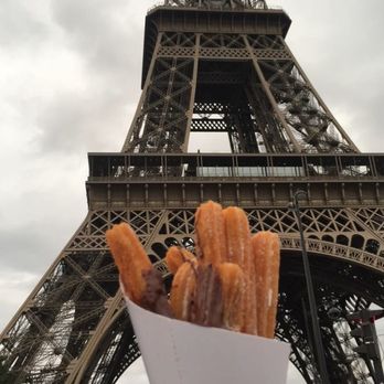 La Tour Eiffel - Churros with Chocolate (they sell them in the small carts/kiosks in front) - Landmarks & Historical Buildings Near Me - Paris, 75 La Tour Eiffel - Churros with Chocolate (they sell them in the small carts/kiosks in front) - Landmarks & Historical Buildings Near Me - Paris, 75