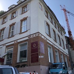 Hotel Kurklinik am Olgabad - Exterior of the clinic with a crane and construction scaffolding blocking most patient's rooms view and light.