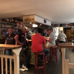 Le Mouillage - Match in progress. Welcoming owner on left.