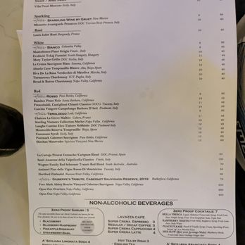 M’tucci’s Bar Roma - Menu - A printed wine menu from M’tucci's Bar Roma in Albuquerque features sections for different wine types, including sparkling, rosé, white, red, and non-alcoholic beverages, with prices listed. - Cocktail Bars Near Me - Albuquerque, New Mexico