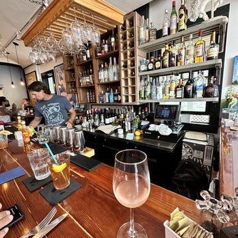 Cafe Heaven - a bar with a wine glass on the bar - Breakfast & Brunch Near Me - Provincetown, Massachusetts Cafe Heaven - a bar with a wine glass on the bar - Breakfast & Brunch Near Me - Provincetown, Massachusetts