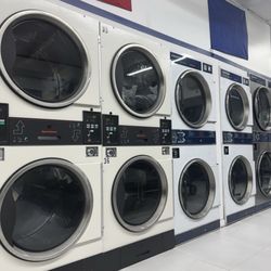 Wash House Coin Laundry - $3 wash & 25¢/10mins of dryer. They also have wash and folding services which are amazing.