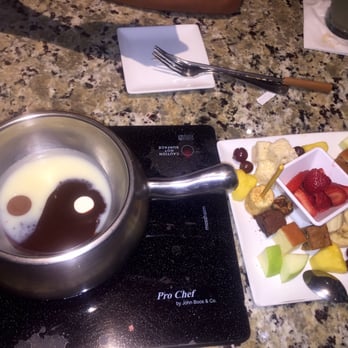 The Melting Pot - Ying and Yang chocolate (white and milk chocolate) with fruit, marshmallows, brownies, and rice Krispy treats. - Fondue Near Me - Savannah, Georgia The Melting Pot - Ying and Yang chocolate (white and milk chocolate) with fruit, marshmallows, brownies, and rice Krispy treats. - Fondue Near Me - Savannah, Georgia
