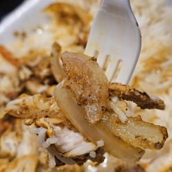 Cello Coffee House & Cafe - A fork holding a piece of the Chicken Shawerma Platter.