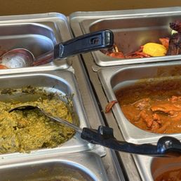 Buffet trays containing Indian and Himalayan dishes, including curries and vegetable preparations, are shown with serving utensils.