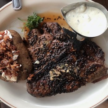 Daniel's Broiler - Leschi - Peppercorn crusted Porterhouse with blue cheese dipping sauce and baked potato - Seafood Near Me - Seattle, Washington Daniel's Broiler - Leschi - Peppercorn crusted Porterhouse with blue cheese dipping sauce and baked potato - Seafood Near Me - Seattle, Washington