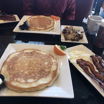 Keke's Breakfast Cafe - Pancakes light fluffy and extremely huge! Two over easy eggs 4 strips crisp to perfection bacon and home fries - Breakfast & Brunch Near Me - St Augustine, Florida Keke's Breakfast Cafe - Pancakes light fluffy and extremely huge! Two over easy eggs 4 strips crisp to perfection bacon and home fries - Breakfast & Brunch Near Me - St Augustine, Florida