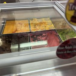 La Flor De Michoacán Paletería y Nevería - There's my rose petal chocolate flavor that I got. I don't recall what the orange flavors were in the back but one I believe is mango.
