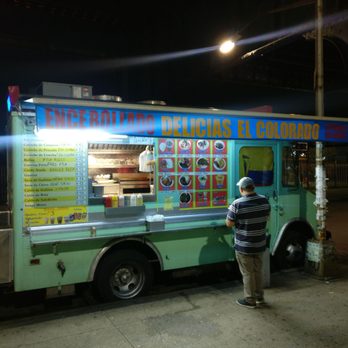 Delicias El Colorado - a man standing in front of a food truck - Food Trucks Near Me Delicias El Colorado - a man standing in front of a food truck - Food Trucks Near Me
