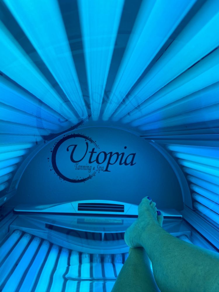 Utopia Tanning & Spa Logo