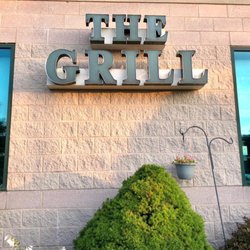 The outdoor sign for The Grill at the Dome