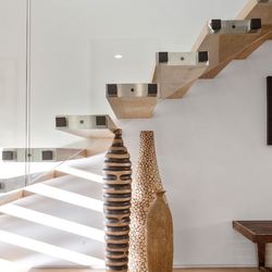 Mountain Metal Works - Floating staircase with Glass Balustrades
