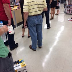 Walgreens - Shocker- the line goes all the way to the back wall by the food section. Two cashiers are open.