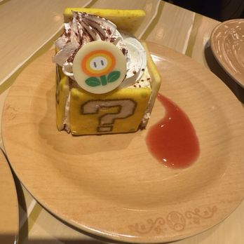 Toadstool Cafe - Tiramisu coin cake - Cafes Near Me - Universal City, California Toadstool Cafe - Tiramisu coin cake - Cafes Near Me - Universal City, California