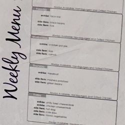 Weekly lunch menu for cafeteria displayed on the door for week of March 17-21, 2025.