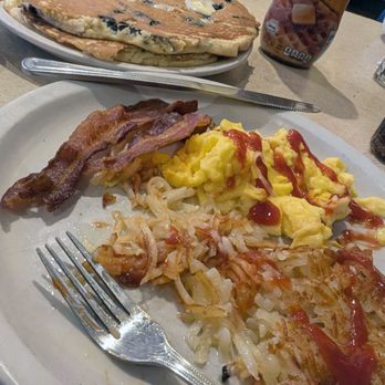 The Big Biscuit - Giant blueberry pancakes + crispy hash browns + fluffy eggs + bacon, aka a comfort breakfast dream - Breakfast & Brunch Near Me - Kansas City, Missouri The Big Biscuit - Giant blueberry pancakes + crispy hash browns + fluffy eggs + bacon, aka a comfort breakfast dream - Breakfast & Brunch Near Me - Kansas City, Missouri