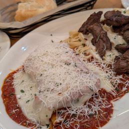 Lasagna with steak over fettuccine Alfredo... DELICIOUS! their bread and sauce is amazing too! Lasagna with steak over fettuccine Alfredo... DELICIOUS! their bread and sauce is amazing too!