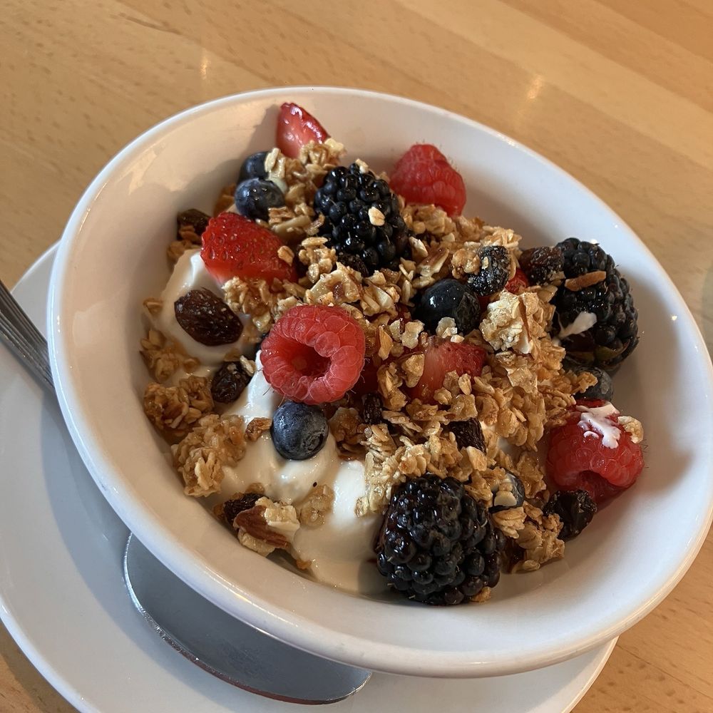 Ellen's - Yogurt Bowl with Vanilla greek yogurt, granola, raisins, and a berry medley. - Breakfast & Brunch Near Me - Dallas, Texas Ellen's - Yogurt Bowl with Vanilla greek yogurt, granola, raisins, and a berry medley. - Breakfast & Brunch Near Me - Dallas, Texas