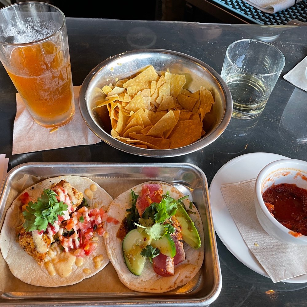 Union Taco - Left to Right: El Guapo Draft, Mahi taco, Chips, Ahi Tuna taco, Milagro Reposado Tequila, Salsa, water. - Tacos Near Me - Norfolk, Virginia Union Taco - Left to Right: El Guapo Draft, Mahi taco, Chips, Ahi Tuna taco, Milagro Reposado Tequila, Salsa, water. - Tacos Near Me - Norfolk, Virginia