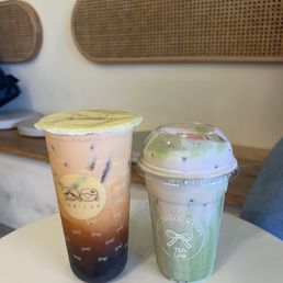 left: thai tea with boba | right: sakura matcha cloud left: thai tea with boba | right: sakura matcha cloud