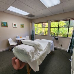 Gina Marks LAc Acupuncture & Wellness Center - Comfortable treatment room with natural light.