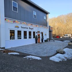 Storefront, downhill from the road.