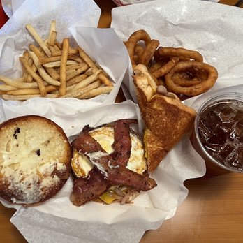 Maple and Motor - Bacon Burger with a fried egg with a bacon grilled cheese sandwich and onion rings and fries on the side - Burgers Near Me - Dallas, Texas Maple and Motor - Bacon Burger with a fried egg with a bacon grilled cheese sandwich and onion rings and fries on the side - Burgers Near Me - Dallas, Texas