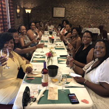 Gregory Vineyards - a group of women sitting at a long table - Venues & Event Spaces Near Me - Angier, North Carolina