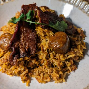 Pippal - Goan chorizo pulao - fried onion, crispy bacon, garlic raita - Indian Near Me - Emeryville, California Pippal - Goan chorizo pulao - fried onion, crispy bacon, garlic raita - Indian Near Me - Emeryville, California