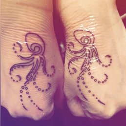 Our cute little matching octopus tattoos done by Josh