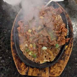 Beijing Legend Restaurant - Beef satay sauce on a hot plate
