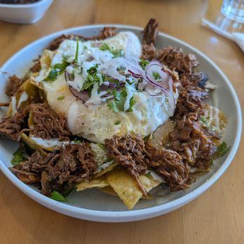 Milpa  - Side of Birria with green sauce chilaqulies and an OE egg - Breakfast & Brunch Near Me - Las Vegas, Nevada
