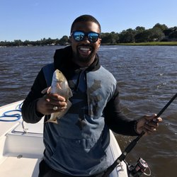 Exclusive Fishing Charters - Despite windy conditions many redfish were biting! www.exclusivefishingcharters.com