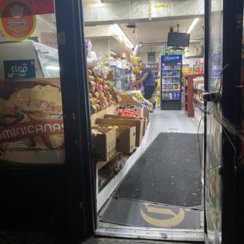 Pino Grocery - a man walking into a store - Grocery Near Me - Corona, New York Pino Grocery - a man walking into a store - Grocery Near Me - Corona, New York