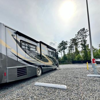 Powered Storage & Parking - RV parked in large space in Powered Storage & Parking facility in Leland - Self Storage Near Me - Leland, North Carolina Powered Storage & Parking - RV parked in large space in Powered Storage & Parking facility in Leland - Self Storage Near Me - Leland, North Carolina